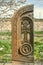 Stone cross carved with ornaments in the form of the sixteenth letter  of the Armenian alphabet,created by Mesrop Mashtots in the