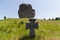 Stone cross on medieval Cossack grave against the single rock