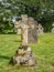 Stone cross with moss and lichen