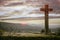 Stone cross with a stunning sky at sunset