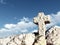 Stone cross under cloudy sky