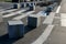 Stone cubes barriers as protection of a nice lawn cube cubes on a paved sidewalk platform of a tram protected from the entry of ca