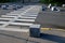 Stone cubes barriers as protection of a nice lawn cube cubes on a paved sidewalk platform of a tram protected from the entry of ca