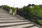 Stone desert staircase in a quiet Scandinavian-style village. Steps among the greenery