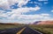 Stone desert in the USA. Picturesque road in the arid plain of Arizona