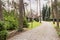 Stone driveway to english red brick residence in the forest