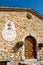 Stone facade of the Chapel of the Penitents with its sundial, in Upaix, Hautes-Alpes, Franc