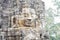 Stone face ruin of ancient buddhist temple Bayon in Angkor Wat complex, Cambodia. Ancient architecture