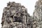Stone face tower of ancient buddhist temple Bayon in Angkor Wat complex, Cambodia. Ancient architecture