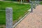 Stone fence post at the monument to the fallen in the war. Connected to another metal chain, protects against entering the lawn. c