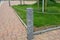 Stone fence post at the monument to the fallen in the war. Connected to another metal chain, protects against entering the lawn. c