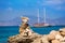 Stone figures on beach shore of Illetes beach in Formentera
