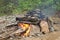 Stone fireplace for hiking Russian bath in the forest.