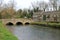 Stone footbridge landscape in cotswolds, england