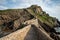 Stone footpath to famous landmark and film location in North of Spain, ocean islet with chapel San juan de gaztelugatxe, Basque