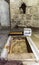 Stone with the footprint of the Foot of Christ surrounded by a marble frame in Chapel of the Ascension on Mount Eleon - Mount of