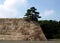 Stone Fortress Wall With Japan Pine Tree On The Top