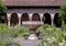 Stone fountain in a garden in the Cloisters in New York City.