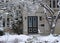 Stone fronted snow covered house