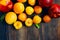 Stone fruits on wooden background. Yellow plums, apricots and nectarines