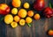 Stone fruits on wooden background. Yellow plums, apricots and nectarines