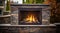 Stone gas fireplace in the garden in the outdoor kitchen