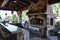 Stone gas fireplace in the garden in the outdoor kitchen