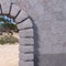 Stone gate corner with granite wall