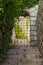 Stone gate locked with steel grating