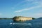 Stone headland in Croatia with jetski