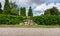 Stone hedge covered with ivy in the park