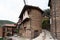 Stone hermitage with bell tower and large wooden door called the meek lamb in Robledillo de Gata