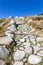 Stone hiking trail to the Laguna Grande de Gredos lake from the Plataforma de Gredos, Spain