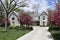 Stone home with flowering trees