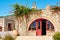 The stone house and the curling bush.Greece, Rhodes.