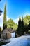 Stone house with native bushes and conifers