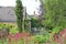 Stone house Patio with garden furniture in private tree secluded space