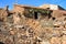 Stone house on a stone cliff on a sunny day