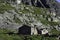 Stone house or typical mountain hut on the slopes of the French Alps