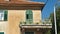 Stone house with windows and balcony in the street of old town, beautiful architecture, sunny day, Split, Croatia