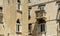 Stone houses with windows and balcony in the street of old town, Diocletian`s Palace beautiful architecture, sunny day, Split,