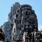 Stone human faces on the towers of the Khmer Bayon Temple in Cambodia