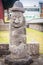 Stone idol (Dolharubang, the grandfather stones) at front of J