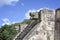 Stone jaguar head statue at the Platform of the Eagles and Jaguars in Mayan Ruins of Chichen Itza, Mexico