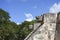 Stone jaguar head statue at the Platform of the Eagles and Jaguars in Mayan Ruins of Chichen Itza, Mexico