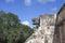 Stone jaguar head statue at the Platform of the Eagles and Jaguars in Mayan Ruins of Chichen Itza, Mexico