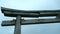 Stone Japanese Arch. Clip. Stone arch in Chinese style on background cloudy sky. Close-up of part of stone arch on