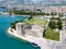 Stone Kamerlengo Castle, medieval city walls and yachts marina. Aerial view of touristic old Trogir, historic town.