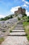 The stone ladder conducting in fortress at mountain top