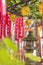 Stone lantern covered with green moss in a small Shinto Shozoku Inari Shrine.